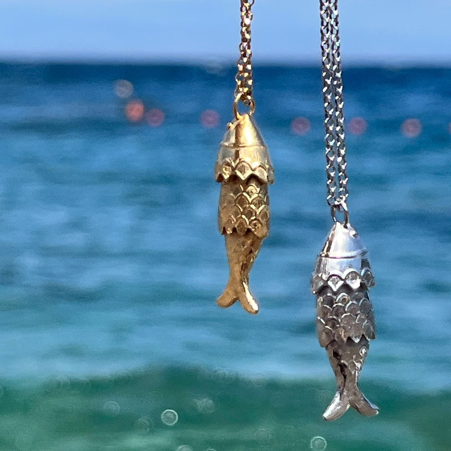 FISH PENDANTS IN GOLD AND SILVER